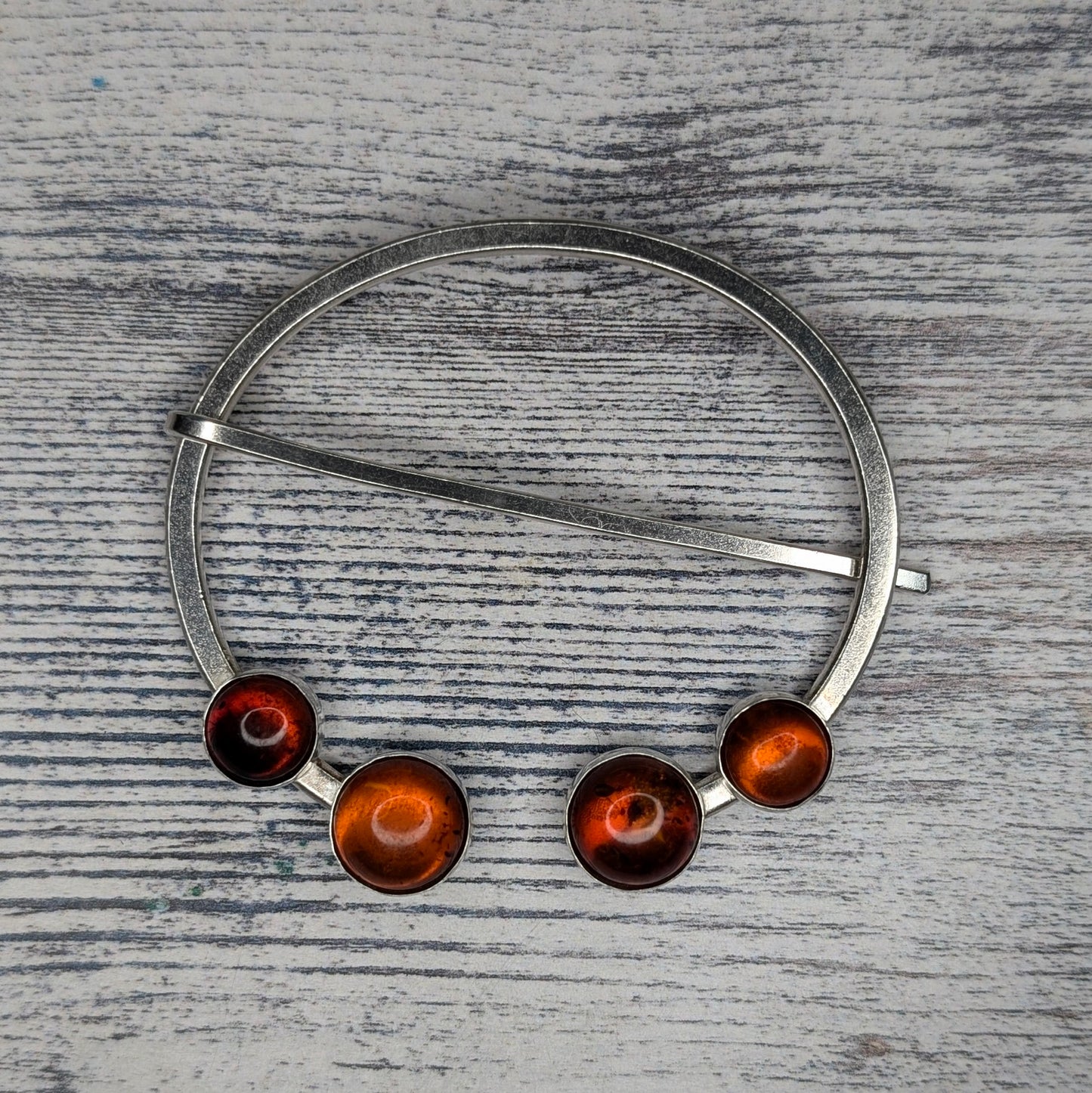 double-amber penannular pin