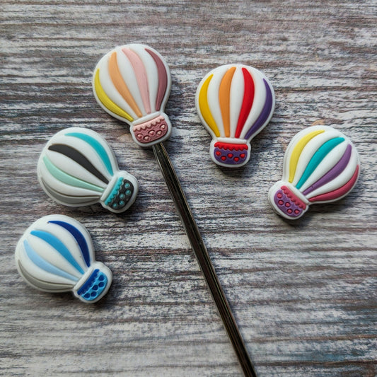 Balloon needle stoppers