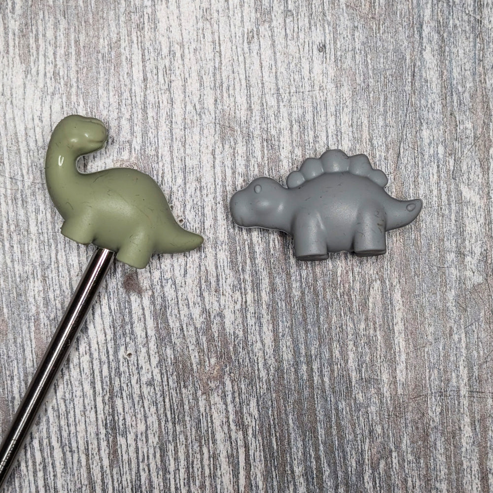 Dinosaur needle toppers