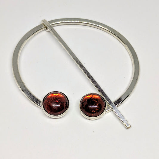 Large amber penannular pin