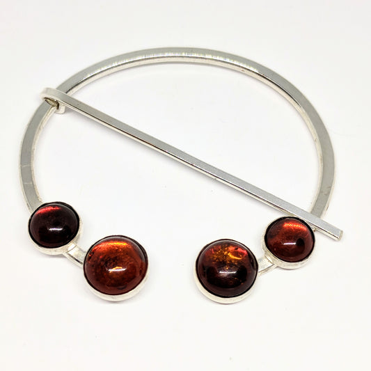 Large amber penannular pin